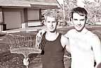 Rodrigo and Kyler of Boardwalk, Fort Lauderdale, clean up after Wilma